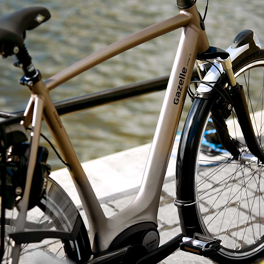 Op onze nieuwe Orange hebben we de achterdrager én de kabels en motoren van de elektrische variant nog verder geïntegreerd.